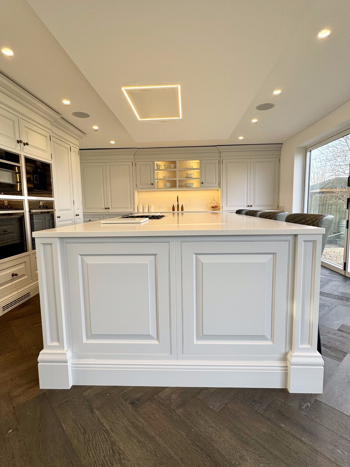 Shaker kitchen island with feature ceiling light