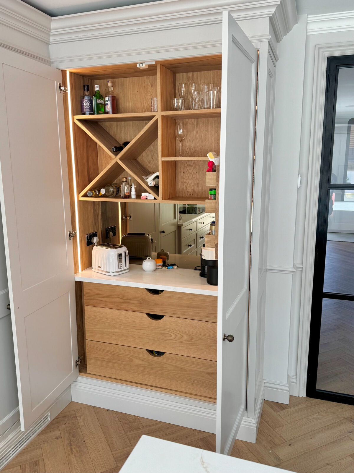 Shaker breakfast and drinks larder with oak wine rack interior