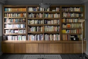 Bespoke walnut library bookcase with integrated lighting